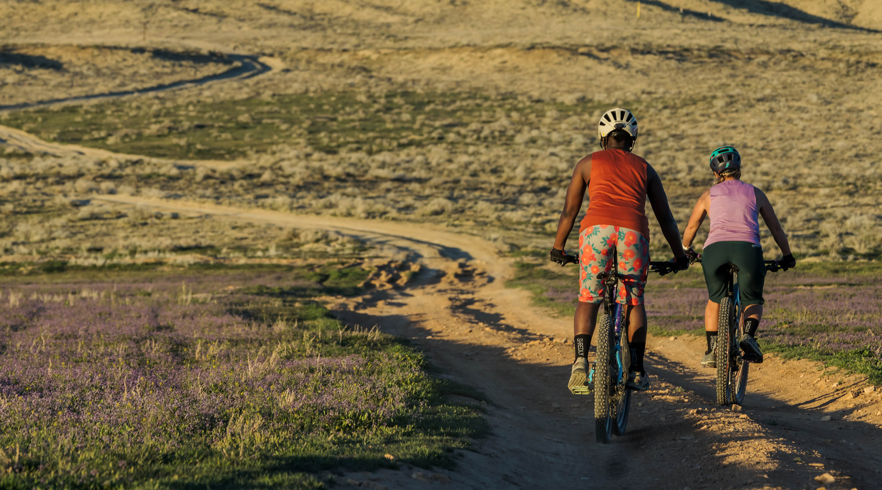 Two women riding mountain bikes in the Colorado high desert