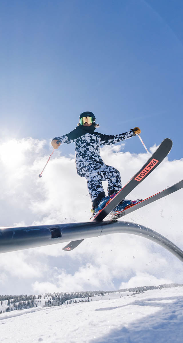 Mobile Version - Women sliding down a rail on skis